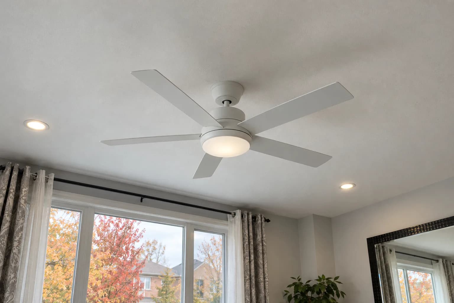 White ceiling fan with an integrated light in a bright Brampton living room