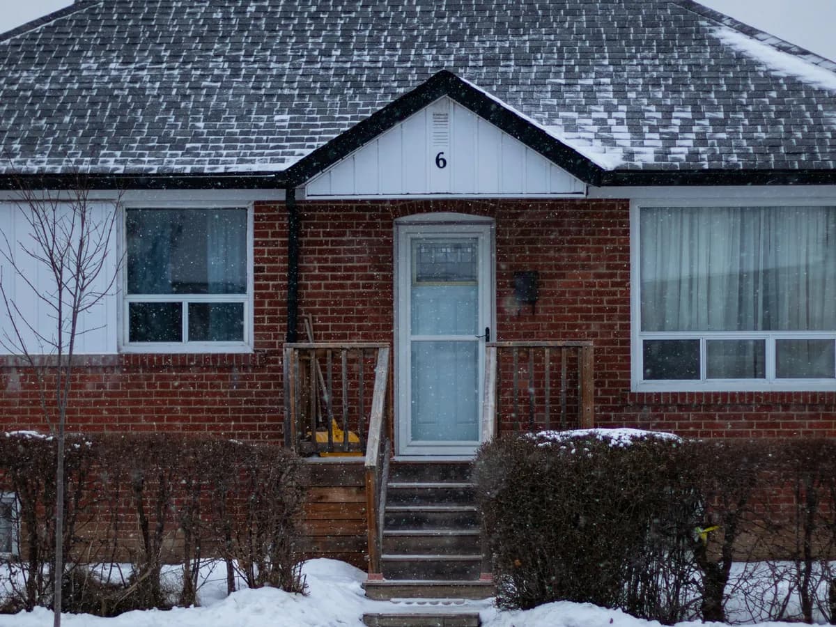 Post-war red brick bungalow in Toronto in winter