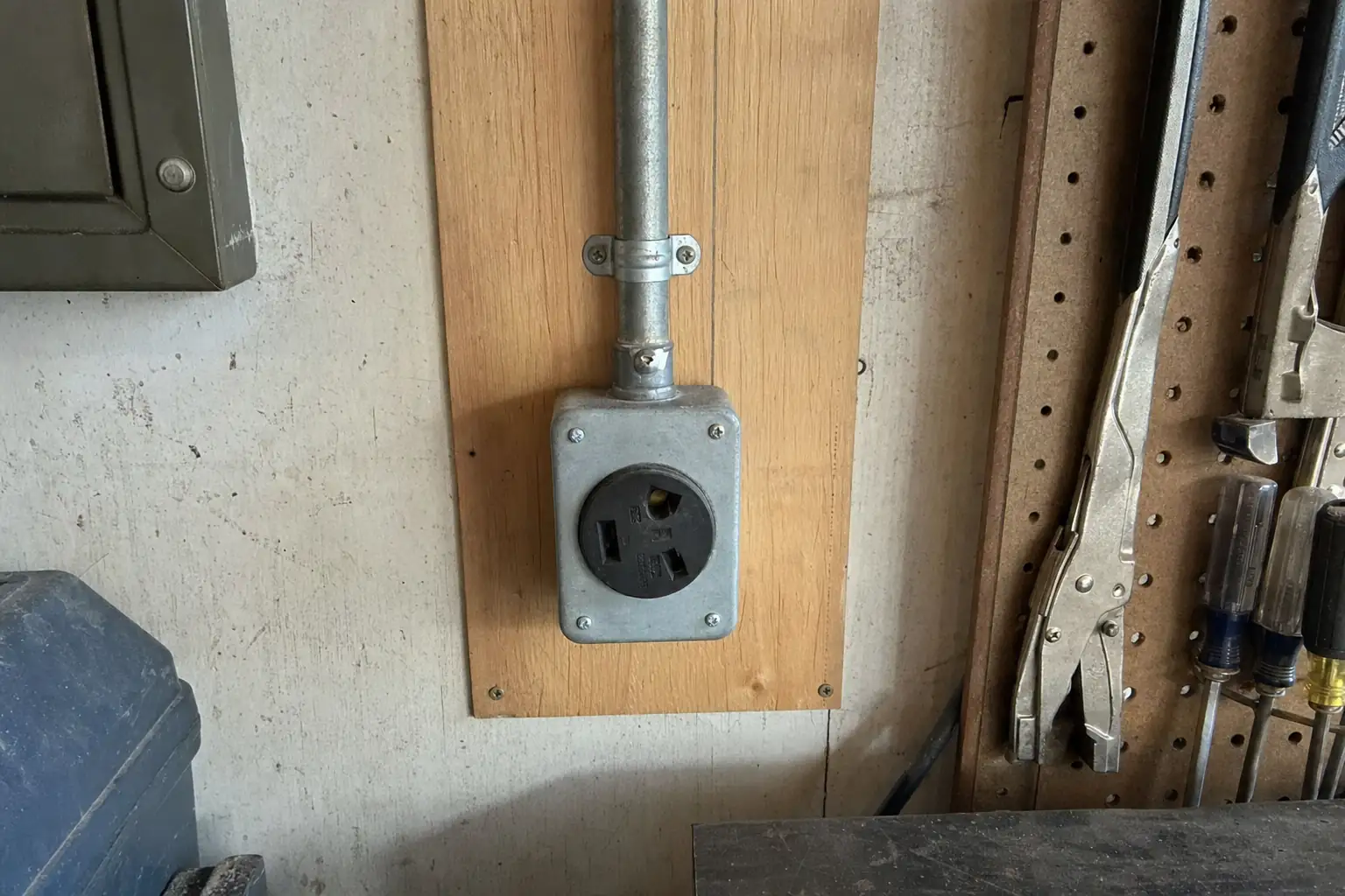 Heavy-duty 240V welder outlet in a garage workshop