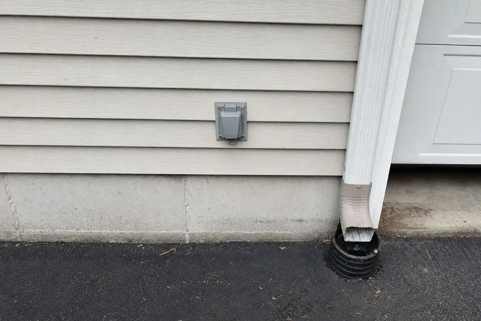 Generator inlet box mounted on a garage wall