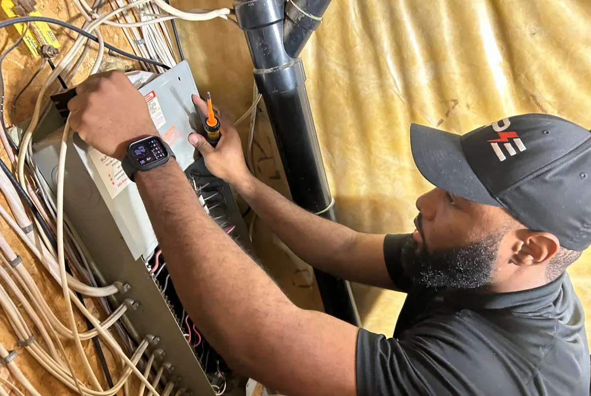 Close-up of Shaun working inside a panel
